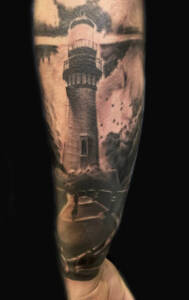 Tattoo Anansi Studio München Munich Haidhausen Peter lighthouse tower watchtower landscape 