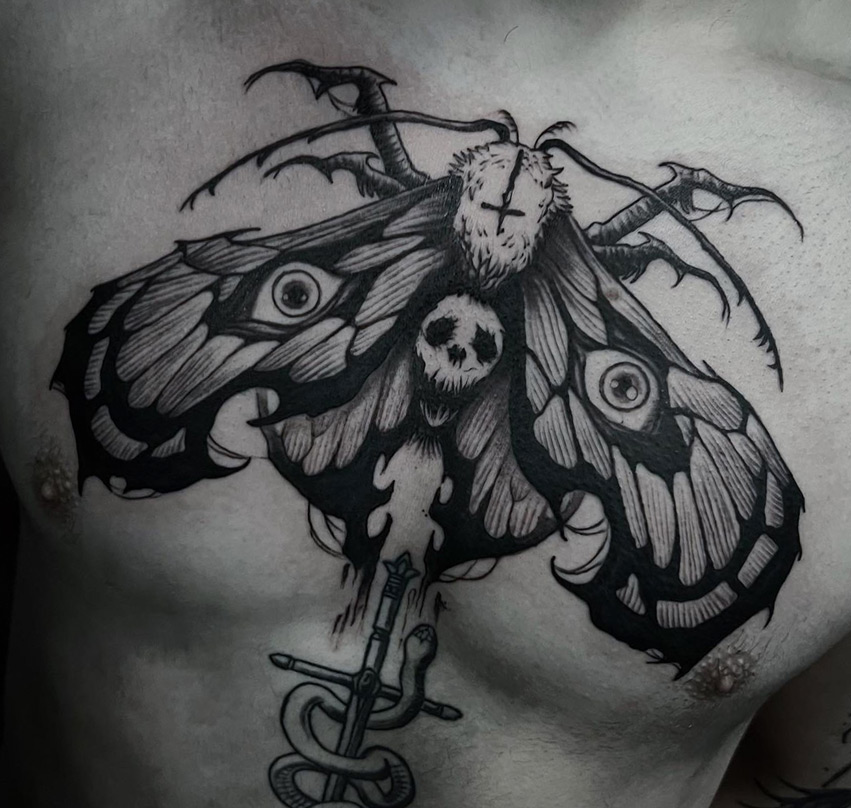 Tattoo Anansi Studio München Munich Haidhausen David moth dark creature spikes eyes skull antlers chestpiece best blackwork